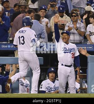 Los Angeles, United States. 19th Aug, 2021. Los Angeles Dodgers' short stop  Corey Seager (5) celebrates with manager Dave Robets (30) after hitting a  two-RBI home run off Pittsburgh Pirates' relief pitcher