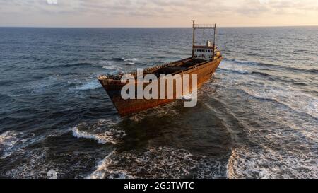 Demetrios II shipwreck in Chloraka, Paphos.  It was a merchant ship which was carried by the waves and sea currents  and hit against the rocks in the Stock Photo