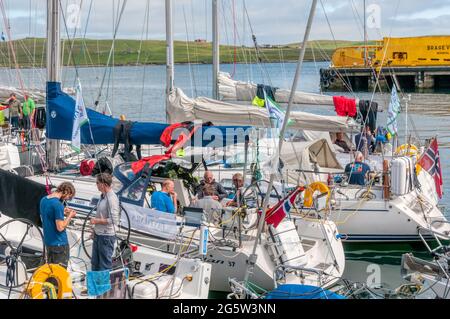 People on yachts in Lerwick harbour, Shetland. Stock Photo