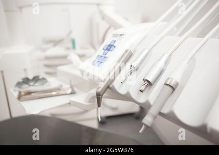 Close up of dental instruments on dental chair at the clinic, copy space Stock Photo