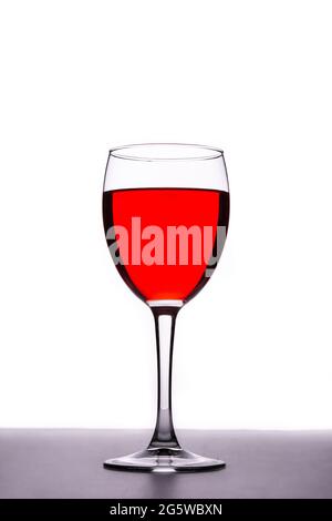 Glass of red wine on white background Stock Photo