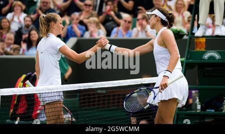 Wimbledon, UK, 2021, Fiona Ferro of France and Garbine Muguruza of Spain at the net during the first round of The Championships Wimbledon 2021, Grand Slam tennis tournament on June 28, 2021 at All England Lawn Tennis and Croquet Club in London, England - Photo Rob Prange / Spain DPPI / DPPI Stock Photo