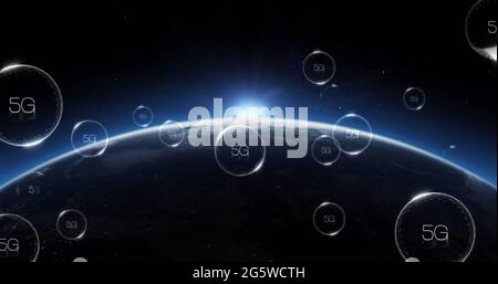Multiple bubbles with 5g text floating and bursting against blue spot of light over globe Stock Photo