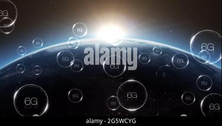 Multiple bubbles with 6g text floating and bursting against blue spot of light over globe Stock Photo