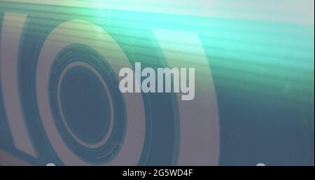 Digital image of light trails and glitch effect against round scanner on red background Stock Photo