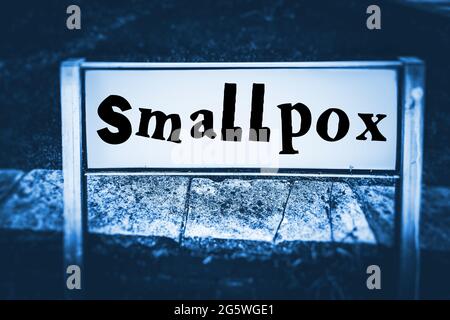 Smallpox displayed on a road sign in a blue tone Stock Photo