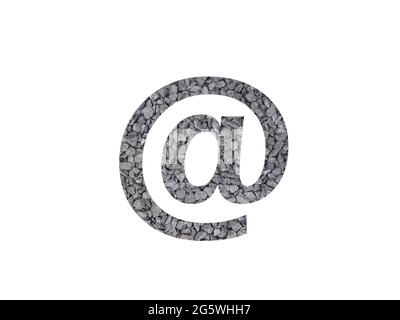 at sign, mail sign of the alphabet made with grey gravel isolated on a white background Stock Photo