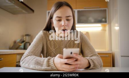 Teenage girl got upset and stressed after receiving negative information or abuse in social media Stock Photo