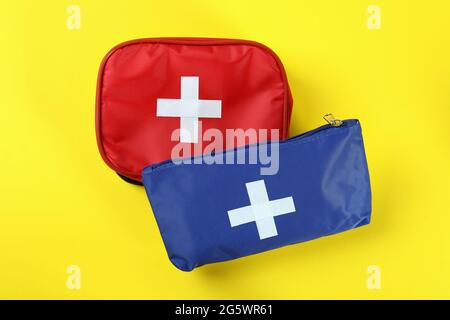 First aid medical kits on yellow background Stock Photo