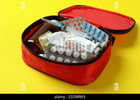 First aid medical kit on yellow background Stock Photo