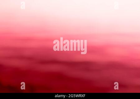 Abstract shot of blurred sea water surface with skyline. Background Stock Photo