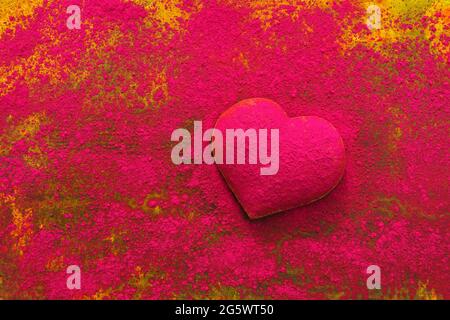 Heart shape dusted with dry powder paint pigment. Stock Photo