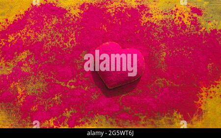 Heart shape dusted with dry powder paint pigment. Stock Photo