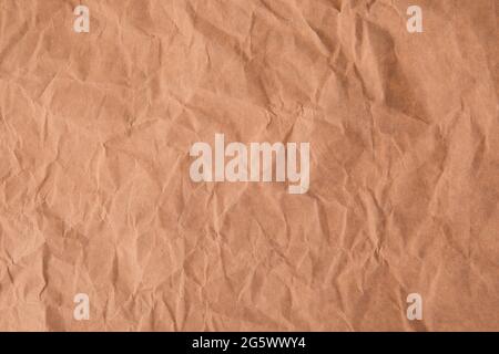 Crumpled recycled brown paper texture background Stock Photo