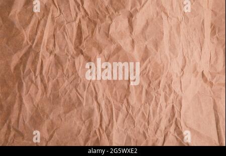 Crumpled recycled brown paper texture background Stock Photo