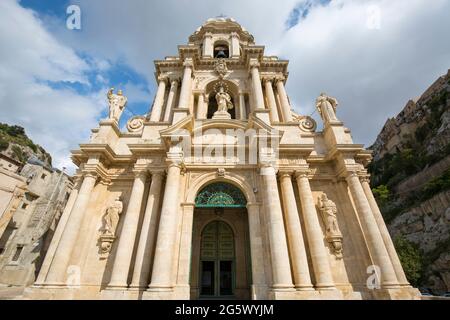 Scicli, Ragusa, Sicily, Italy. Low angle view of the the richly decorated baroque façade of the Church of San Bartolomeo. Stock Photo