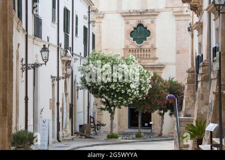 Scicli, Ragusa, Sicily, Italy. View along peaceful Via Francesco Mormina Penna to the eye-catching east front of the Church of Santa Teresa d'Avila. Stock Photo