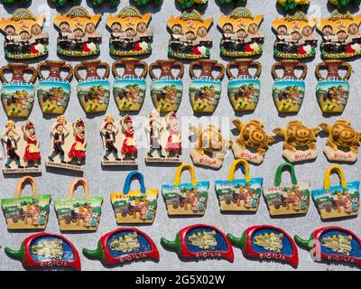 Noto, Syracuse, Sicily, Italy. Brightly coloured fridge magnets on display outside a typical souvenir shop in Corso Vittorio Emanuele. Stock Photo