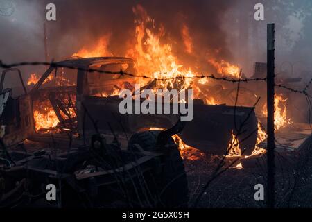 Weed, California, USA. 29th June, 2021. A truck is seen burning at a resident at the Tennant Fire. Credit: Jungho Kim/ZUMA Wire/Alamy Live News Stock Photo
