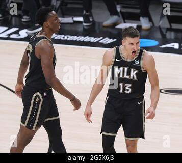 Atlanta, USA. 29th June, 2021. The Atlanta Hawks' Bogdan Bogdanovic (13) reacts to hitting a 3-point shot against the Milwaukee Bucks during the second quarter in Game 4 of the Eastern Conference Finals on Tuesday, June 29, 2021, at State Farm Arena in Atlanta. (Photo by Curtis Compton/Atlanta Journal-Constitution/TNS/Sipa USA) Credit: Sipa USA/Alamy Live News Stock Photo