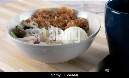 "Laksa" is a spicy noodle soup popular in the Peranakan cuisine. Selective focus of a bowl of "laksa" known in malay. Stock Photo
