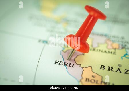 Location Peru, red push pin on the travel map, marker and point closeup, tourism and trip concept, South America Stock Photo
