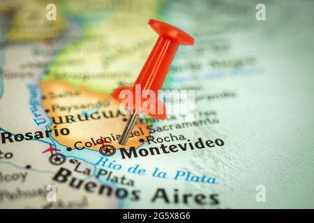 Location Montevideo city on Uruguay, red push pin on the travel map, marker and point closeup, tourism and trip concept, South America Stock Photo