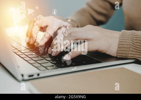 5G. business woman working on laptop computer on desk with graphic world map diagram, communication, internet security, financial, online marketing, b Stock Photo