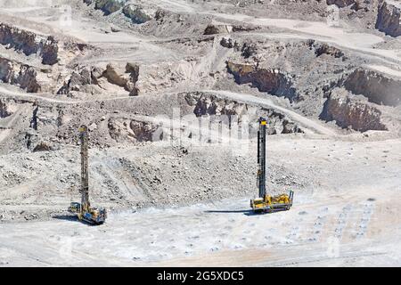 Blasthole drill in an open pit copper mine operation in Chile Stock Photo