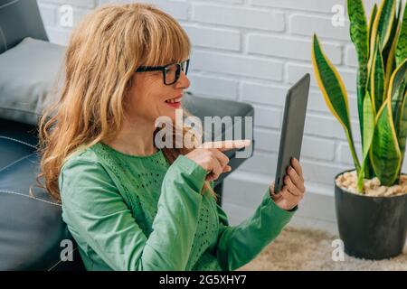 woman with tablet device at home Stock Photo