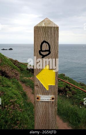 An acorn way marker, the symbol of the South West Coastal Path, near Coleton Fishacre, Kingswear in the South Hams district of Devon. Stock Photo