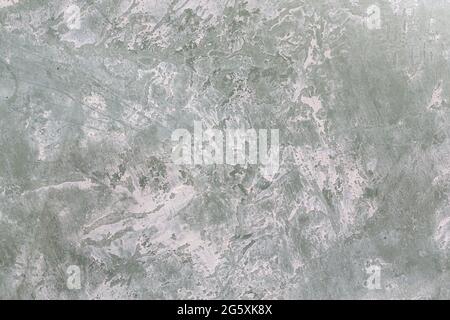Green background with white grainy paint. Stock Photo