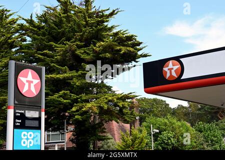 Bournemouth, England - June 2021: Signs outside a petrol filling station operate by the Co-op and supplied by the Texaco oil company Stock Photo