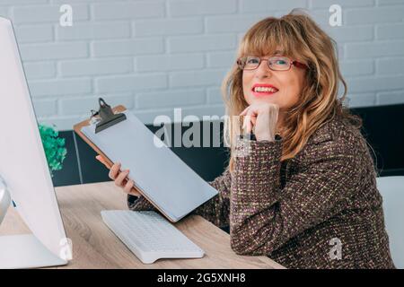 businesswoman working in the office with documents and computer Stock Photo