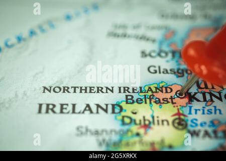 Location Northern Ireland and Belfast, push pin on map closeup, marker of destination for travel, tourism and trip concept, Europe Stock Photo