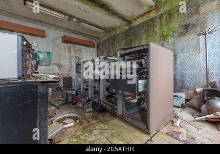Broken old 80s hard disk drive racks. Abandoned computing center Stock Photo