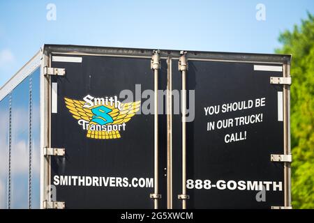 Lexington, USA - May 27, 2021: Highway road in Virginia with truck vehicle for Smith transport and sign for hiring drivers application on online websi Stock Photo