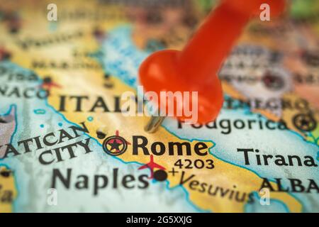 Location Rome in Italy, push pin on map closeup, marker of destination for travel, tourism and trip concept, Europe Stock Photo