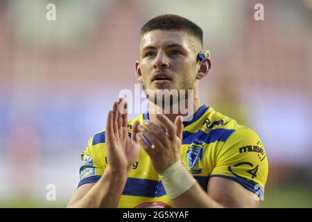 Danny Walker (16) of Warrington Wolves applauds the travelling supporters at the end of the game after beating Wigan Warriors 14-40 Stock Photo