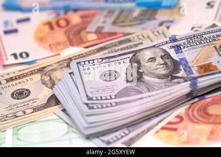Background made of dollar, euro banknotes on a table Stock Photo