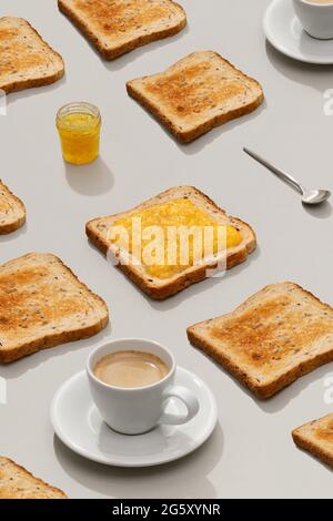 Pattern with toast and lemon jam on gray background Stock Photo