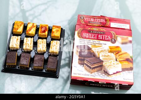 Nellysford, USA - April 29, 2021: Closeup of sign and product of a dozen sweet bites cakes opera, raspberry and caramel storebought at Trader Joe's Stock Photo