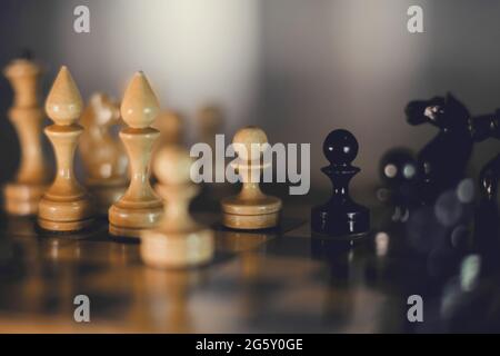 Wooden chess pieces on the chessboard. Intellectual game -chess. Chess pieces on the Board. Stock Photo