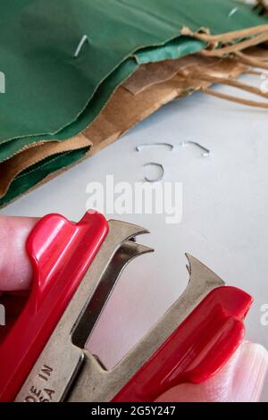 Close up of a Man Using a Stapler Remover, USA Stock Photo