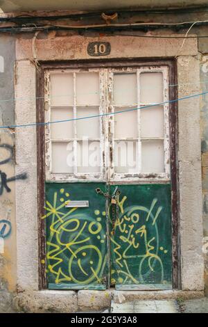 Vanalized metal door with lock on the door Stock Photo