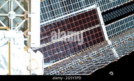The second roll out solar array on the International Space Station after installation by astronauts Thomas Pesquet of ESA and Shane Kimbrough of NASA June 25, 2021 in Earth Orbit. Stock Photo
