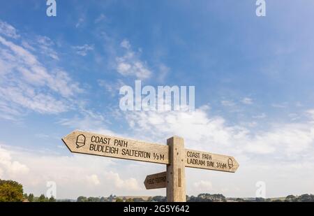 Wooden fingerpost for the South West Coast Path, walking country in Budleigh Salterton, a small south coast town in East Devon, southwest England Stock Photo