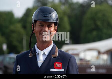 Windsor, Berkshire, UK. 30th June, 2021. A big smile from Olympian Carl Hester as he gets ready to head off to the Olympics in Japan. Set in the private grounds of Windsor Castle, 1,000 lucky guests were able to watch members of the GB Olympic Dressage and GB Olympic Eventing squads today practice their Tokyo tests before they set off to the Olympics 2021 in Tokyo. Royal Windsor Horse Show officially opens tomorrow Wednesday 1st July 2021 and runs until Sunday evening. Credit: Maureen McLean/Alamy Live News Stock Photo