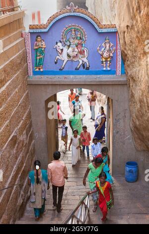 Hindu Indian devotees climbing up the steps that leads to Ucchi Pillayar Temple at Rockfort Temple, Trichy, Tamil Nadu, India Stock Photo