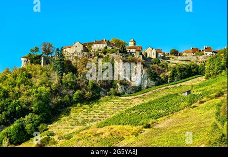 Chateau-Chalon village above its vineyards in Jura, France Stock Photo